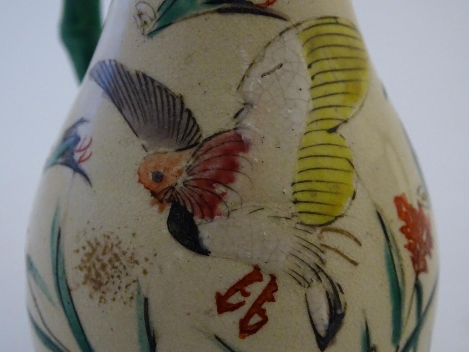 A Japanese teapot and milk jug with hand painted decoration depicting birds and flowers, the handles - Image 9 of 9
