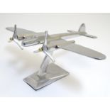 An Art Deco chrome desk model of a twin engined aeroplane, 15" wide, 11 3/4" long, 7 1/4" tall