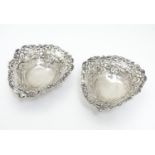 A matched pair of silver bon bon dishes of heart form, hallmarked Birmingham 1895 maker Deakin &