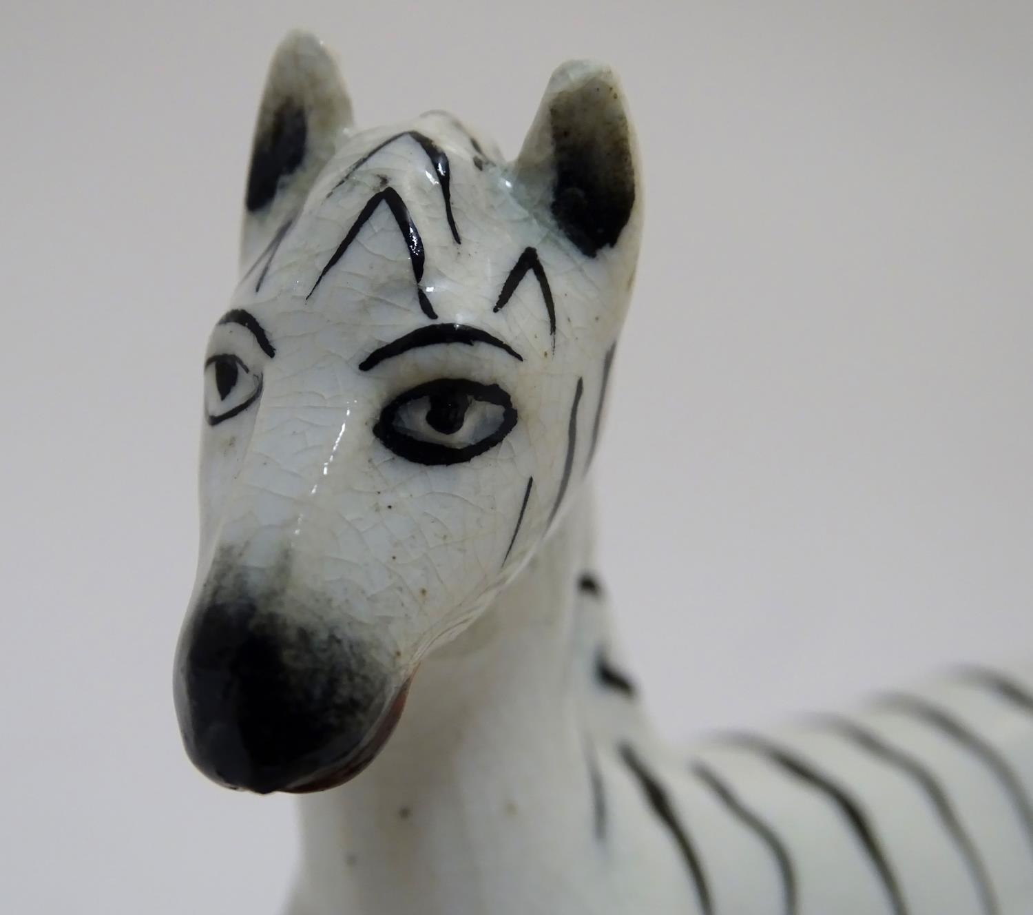A Staffordshire figure modelled as a zebra on a naturalistic oval base. Approx. 4 3/4" high Please - Image 5 of 6