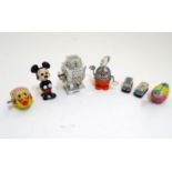 Toys: A quantity of 20thC wind up / clockwork toys to include Moon Stroller Robot, Mickey Mouse, tin