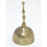 A 19thC cast bronze and bell metal bell. Approx 7" high Please Note - we do not make reference to