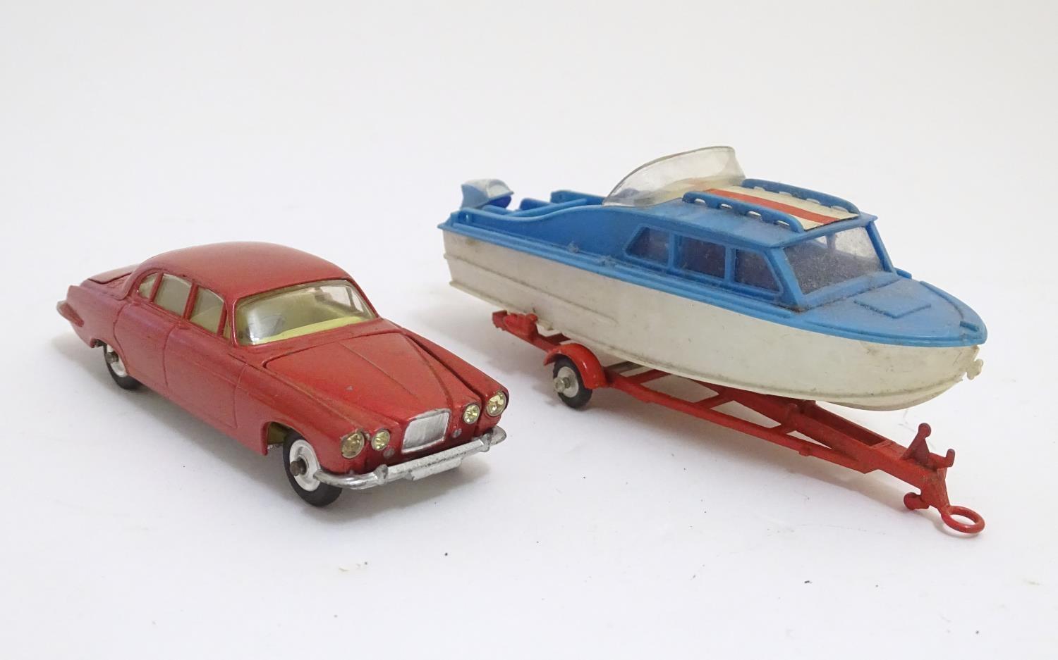 Toys: Two die cast scale model boat and car Corgi Toys to include a Dolphin 20 Cruiser on Wincheon - Image 5 of 8