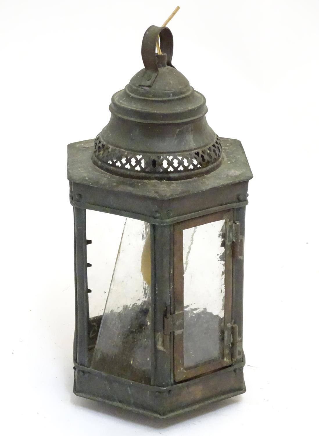 An Arts & Crafts copper hexagonal panelled pendant lantern, approximately 15 1/2" tall Please Note -