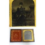 A Victorian daguerreotype /ambrotype depicting a portrait of a young boy in soldier uniform