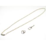 Three items of jewellery comprising a pearl necklace with white metal clasp approx 26" long,