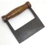 A late Victorian dough cutter, the turned walnut handle with steel blade stamped 'Brades Co, cast