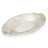 A silver dish with pierced floral decoration hallmarked Sheffield 1996 maker SC. 10" diameter Please