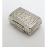 A Geo IV silver vinaigrette with engraved decoration and gilded interior. Hallmarked Birmingham 1828