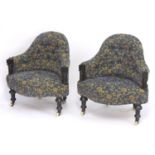 A pair of 19thC armchairs with shaped backrests and fronts, having deep buttoned upholstery and