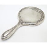 A silver hand mirror with Art Nouveau decoration. hallmarked Birmingham 1912 maker Martin Hall &