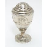 A Geo IV silver pepperette of urn form. Hallmarked London 1823 maker J.A. 3 1/2" Please Note - we do