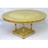 A 20thC bamboo style dining table with a well figured circular top above four turned supports and