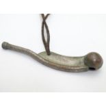Militaria : an early to mid 20thC Bosun's whistle, with leather lanyard, 4 1/2" long Please Note -