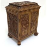 A 19thC Chinese hardwood table cabinet, with carved foliate and floral decoration, the lid with
