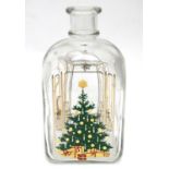 A glass Christmas / Advent decanter, decorated with Christmas tree, chairs, candles and mistletoe,