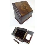 A 19th / early 20thC stationary / correspondence cabinet with folding doors inlaid with marquetry