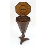 A 19thC sewing table with an octagonal top, parquetry decoration and fitted interior, having a