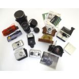 An assortment of camera / photographic equipment, to include a Korol 120 film camera, a Canon AE1