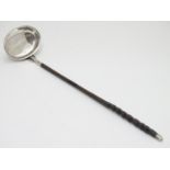 A 19thC white metal toddy ladle with twist handle. Approx 14" long overall. Please Note - we do