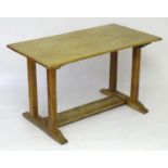 An early 20thC oak Heals library table / refectory table. See similar 'Sir Ambrose Heal and the Heal