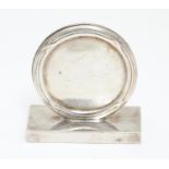 A silver plate table menu / place card holder of circular form by James Dixon & Son. marked under