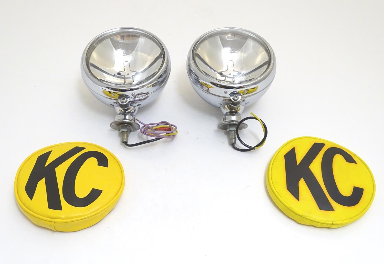 A pair of KC Hilites chromium automotive spotlights with covers, each 6" wide Please Note - we do