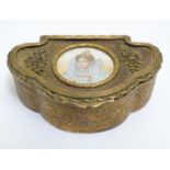 A Victorian brass table / jewel box with hinged lid and engraved acanthus scroll and floral