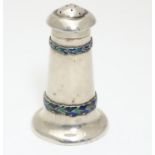A Liberty & Co Arts and Crafts silver pepper pot of tapering cylindrical shape with domed and