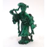 An Oriental malachite carving modelled as a woman in a flowing dress. Approx. 3 1/3" high Please