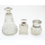 3 assorted glass toilet bottles with silver mounts and lids. The tallest approx 5"(3) Please