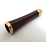A 19thC red amber cheroot mouthpiece with gilt metal mounts. Approx. 1 3/4" Please Note - we do