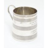 A silver christening mug with banded decoration and loop handle hallmarked London 1809 maker