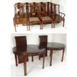 An early 20thC set of twelve dining chairs together with a matching dining table. The Chinese
