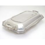 An Art Deco silver plate entree dish and cover by Asprey. 13" wide