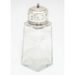 An Art Deco sugar caster / dredger, the squared glass body with banded detail and top hallmarked