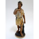 A mid 20thC Italian terracotta figure of a fisherman in Mediterranean costume, 11 3/4" tall Please