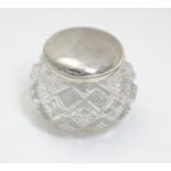 A small cut glass pot with silver top hallmarked Birmingham 1903 maker T H Hazlewood & Co. Approx