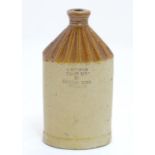 A 19thC stoneware two tone spirit flask / flagon, impressed 'G Bennett, White Lion, 29 Leather Lane,