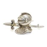 A Victorian silver brooch formed as a sword and knights helmet. Hallmarked Birmingham 1885 maker