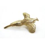 A 9ct brooch / pin formed as a pheasant in flight. 1 1/2" long Please Note - we do not make