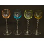 Four liqueur glasses, each having twist stems and coloured bowls, measuring 5 3/8" high (4) Please