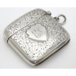 A silver vesta case with engraved foliate decoration hallmarked Birmingham 1900 maker Hilliard &