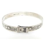 A silver bracelet of bangle form marked W S Ltd Silver. Please Note - we do not make reference to