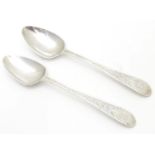 A pair of Geo III Old English pattern teaspoons with bright cut decoration to handles. Hallmarked