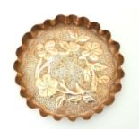 An Arts & Crafts style copper tray with repousse floral decoration and punch detail. Approx. 8"