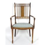 An early 20thC rosewood chair with an inlaid frame and having pierced decoration to the backrest,