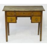 A late 18thC oak lowboy with a rectangular top above a single long drawer and two short drawers with