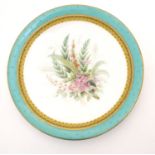 A Worcester dessert plate with hand painted floral and foliate spray to centre, bordered in
