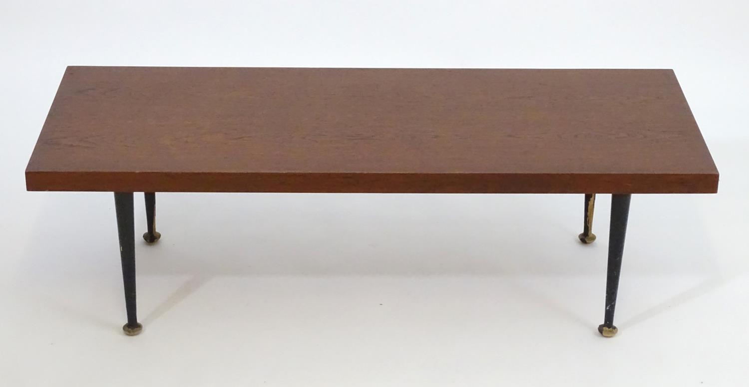 A mid 20thC Meredew coffee table with a rectangular teak top above four turned tapering legs. - Bild 6 aus 7